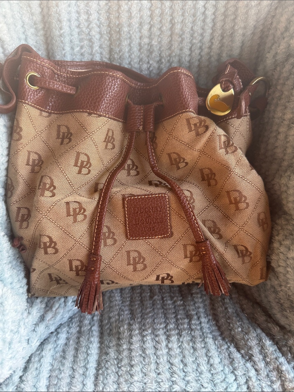 Dooney & Bourke Brown/Tan Logo Drawstring Bucket Bag